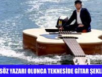 GİTAR ŞEKLİNDE KAYIKTA KLİB ÇEKTİ